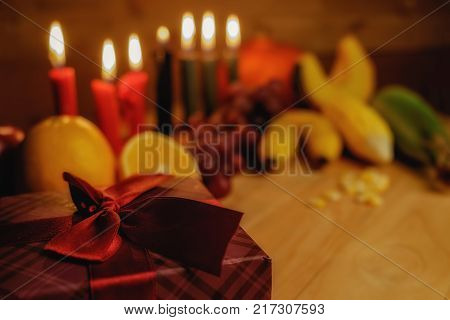 Kwanzaa Holiday Concept With Decorate Seven Candles Red, Black And Green, Gift Box, Pumpkin,corn And