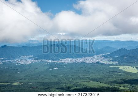 Mountain trail Mount Fuji, climbing the mountain, ruins. View from the mountain to the city