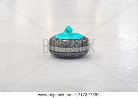 Blue Granite stone for curling game. Sport equipment.