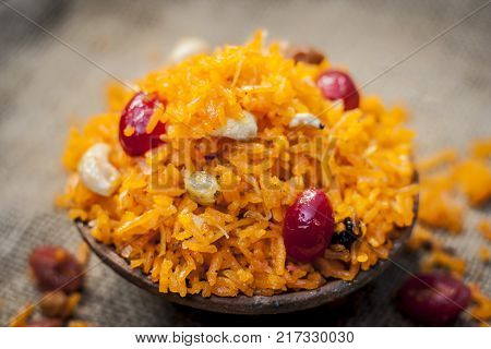 Indian Sweet Rice Dish In A Clay Bowl On Gunny Background.