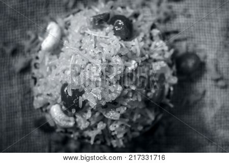 Indian Sweet Rice Dish In A Clay Bowl On Gunny Background.