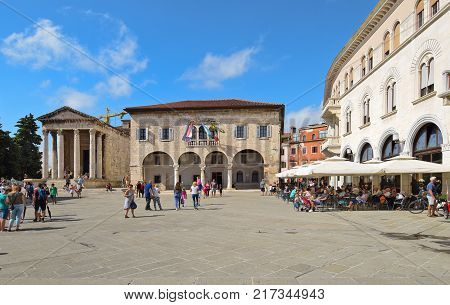 PULA CROATIA - SEPTEMBER 1 2017: The Forum square in Pula; The Forum square is a central square in Pula where main monuments like the Temple of Augustus and the Communal Palace are located.