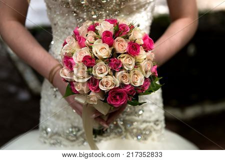 Close up beautiful weding bouquet in bride's hands