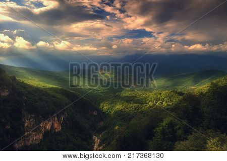Rays of light pass through the clouds, beautiful mountain landscape, georgia, caucasus