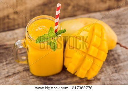 Mango Fruit And Mango Cubes On The Wooden Table