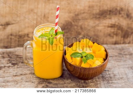 Mango Fruit And Mango Cubes On The Wooden Table