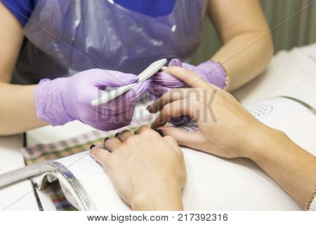 Cute Girl Master Doing A Manicure.