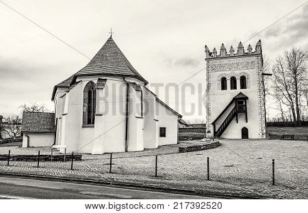 Roman catholic church of St. Anna with renaissance bell tower Strazky Slovak republic. Religious architecture. Travel destination. Black and white photo.