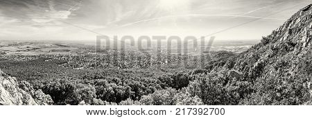 Panoramic view of the Nitra city from Zobor hill Slovak republic. Seasonal landscape. Autumn forest. Tourism theme. Black and white photo.