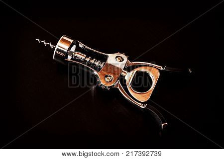 Metallic corkscrew on the dark background. Objekt scene.
