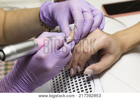 Cute Girl Master Doing A Manicure.