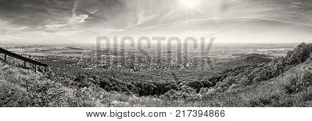 Panoramic view of the Nitra city from Zobor hill Slovak republic. Seasonal landscape. Autumn forest. Tourism theme. Black and white photo.