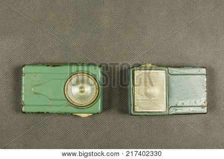 Two old metal hand torches for an alkaline battery.