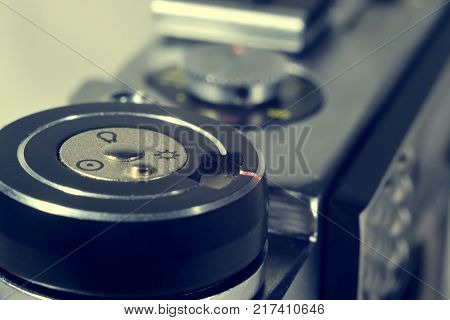 Button of film camera in cross process edition