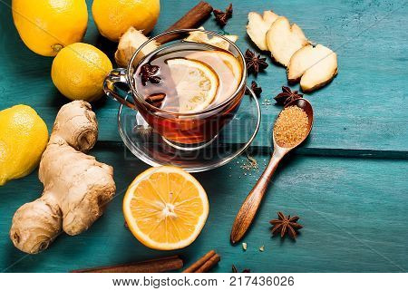 Cup Of Ginger Tea With Lemon And Honey On Dark Blue Background,