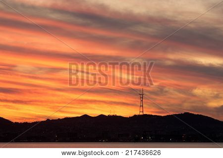 Sutro Tower Sunset as seen from Port of Oakland. Mount Sutro, San Francisco, California, USA.