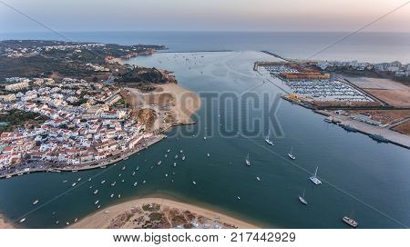 Aerial. Ferragudo at sunset shooting from the sky with drone. Portimao Portugal