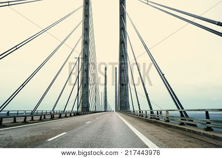A bridge between Denmark and Sweden early in an autumn morning. A Danish-Swedish detective series of the same name is connected with this bridge. The picture is taken in direction of Denmark.