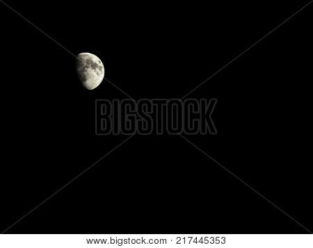A beautiful 3/4 Moon in a Night Sky