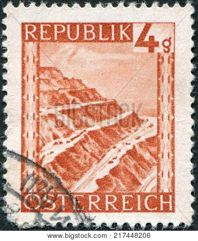 AUSTRIA - CIRCA 1946: A stamp printed in Austria is shown Eisenerz surface mine (Iron ore) circa 1946