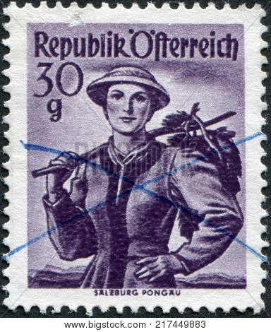 AUSTRIA - CIRCA 1950: A stamp printed in Austria shows a woman in national dress Salzburg Pongau circa 1950