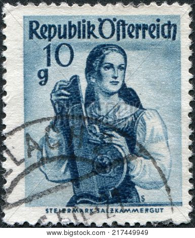 AUSTRIA - CIRCA 1948: A stamp printed in Austria shows a woman in national dress Styria Salzkammergut circa 1948