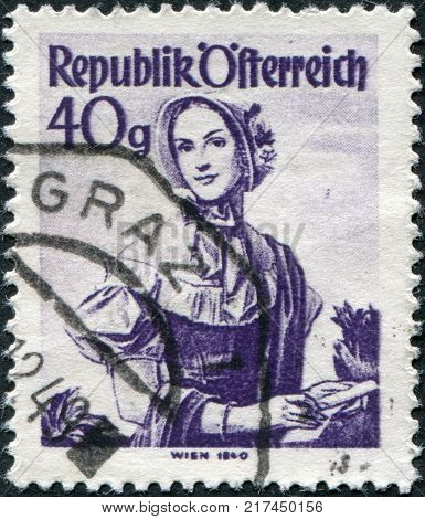 AUSTRIA - CIRCA 1948: A stamp printed in Austria shows a woman in national dress Costume of Vienna 1840 circa 1948