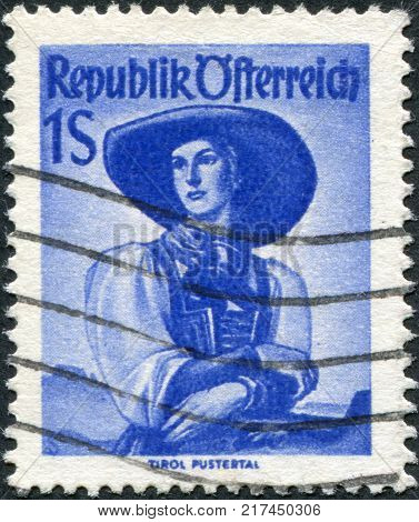 AUSTRIA - CIRCA 1948: A stamp printed in Austria shows a woman in national dress Tyrol Puster Valley circa 1948
