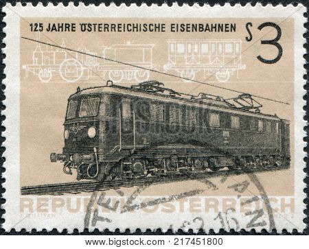 AUSTRIA - CIRCA 1962: A stamp printed in Austria devoted to 125th anniversary of Austrian railroads depicted Electric Locomotive BR1010 and Steam Locomotive 