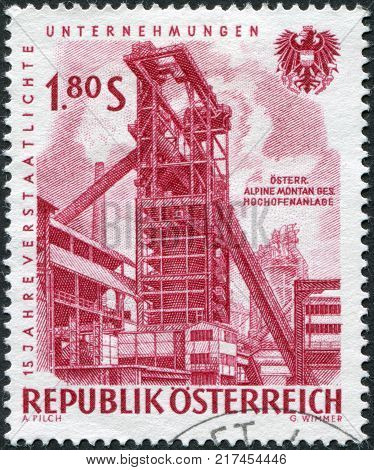 AUSTRIA - CIRCA 1961: A stamp printed in Austria devoted to 15th anniversary of nationalized industry shows a montage Iron blast furnace circa 1961