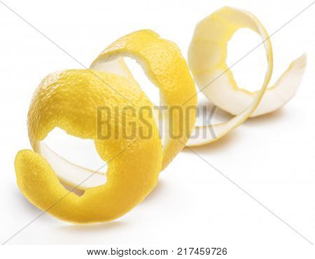 Lemon peel or lemon twist on white background. Close-up.