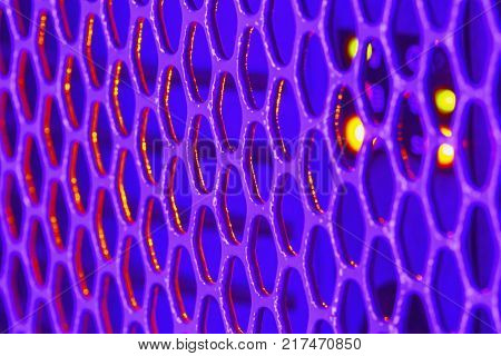 Detail on the violet metal grille on PC with small selective focus low depth of field.
