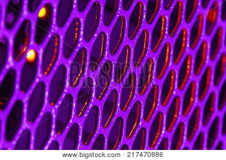Detail on the violet metal grille on PC with small selective focus low depth of field