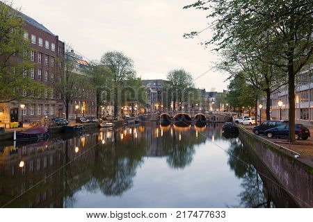 AMSTERDAM, NETHERLANDS - SEPTEMBER 30, 2017: Singel channel early September morning