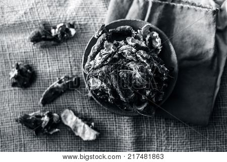 Raw Tamarindus indica,tamarind in a clay bowl on gunny background.