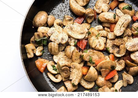 Mushroom Fry or sauteed mushroom or masharoom served in a bowl or in a frying pan over colourful background
