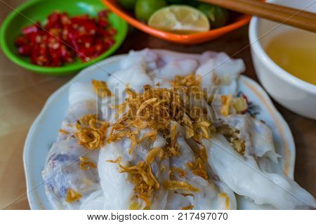 Vietnamese traditional meal stuffed rice pancakes with shallot. Asian street food background