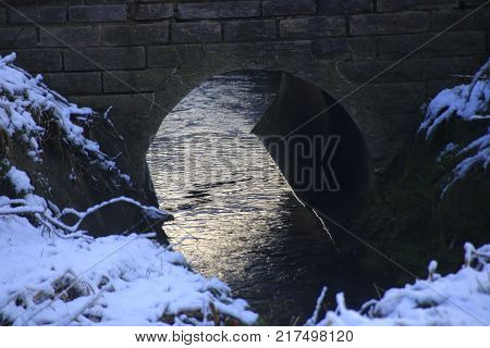 brick bridge over the strudelbach in the lower valley in the community Weissach