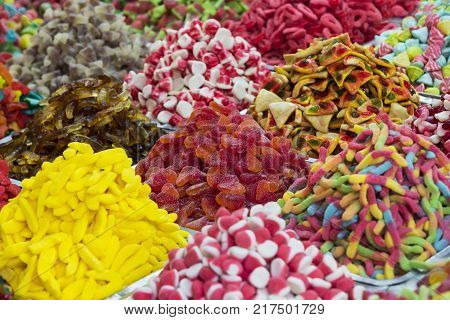 Assortment of jellied colored sweets as a product background