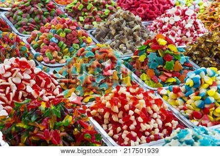 Assortment of jellied colored sweets as a product background