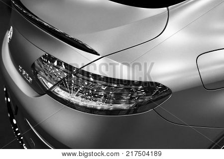 Sankt-Petersburg Russia July 21 2017: Back view of a Mercedes Benz C 63s AMG coupe 2017. Front Headlight. Dark Matt colour. Car exterior details. Black and white. Photo Taken at Royal Auto Show July 21