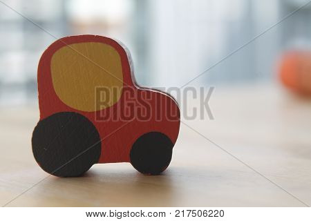 Traditional thai style nature background of brown handicraft weave texture wicker surface for furniture material with red toy car on it