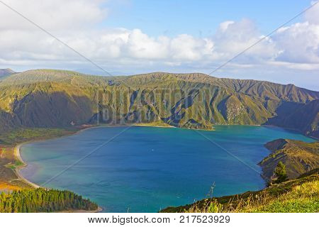 Aerial view of Lake Fogo Sao Miguel Island Azores Portugal. Mountainous landscape of volcanic island with crater lake.