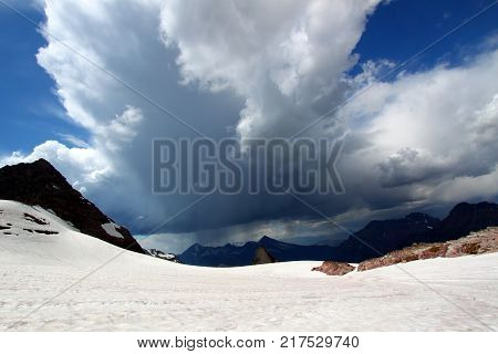 Thunderstorms approach Sperry Glacier in the mountains of Glacier National Park USA