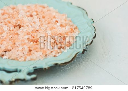Pink Himalayan Salt on Vintage Turquoise Plate White Stone Tabletop Wellness Spa Healthy Diet Nutrition Ayurveda Clean Minimalist Image Copy Space