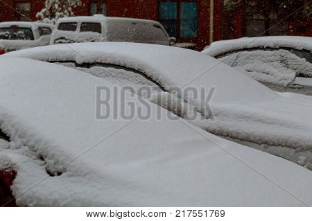 Windshield wipers of an snow covered car after heavy snowfall cars covered snow winter falls snow