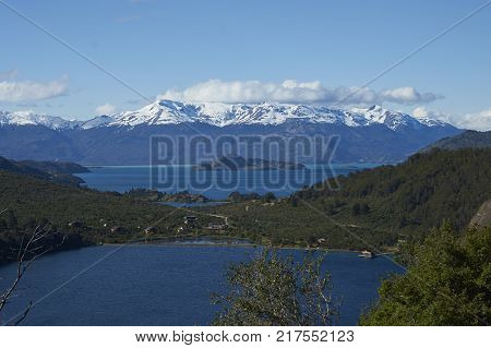 Landscape along the Carretera Austral next to the azure blue waters of Lago General Carrera in Patagonia, Chile. Lago Bertrand in the foreground.
