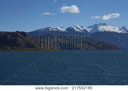 Landscape along the Carretera Austral next to the azure blue waters of Lago Bertrand in Patagonia, Chile
