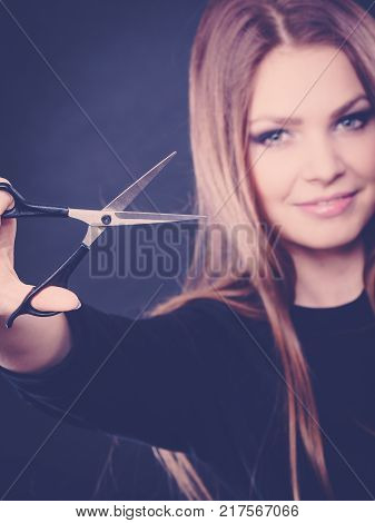 Elegance and classy. Fashion style of hairdo. Female professionalist with scissors. Elegant woman presents her hairdresser's saloon.