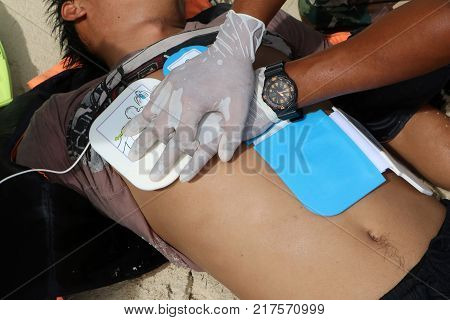 CPR and AED on the beach Training Automated External Defibrillator for Rescue and first aid in Thailand.